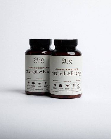 Two bottles of 'Strength & Energy' organic beef liver supplement on a white background